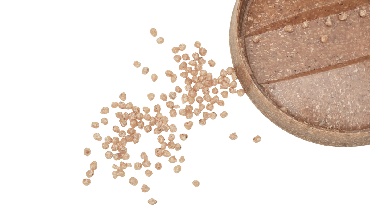 Sulapac pellets scattered around the natural lid
